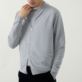 Model wearing John Smedley 16.Singular Extra Fine Knit Jacket in light grey with two-way zip fastening and shawl collar