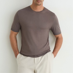 Model wearing Reiss mouse brown crew neck short sleeve T-shirt, styled with light grey trousers