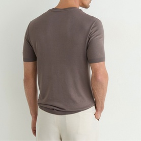 Model wearing Reiss mouse brown crew neck T-shirt, back view, styled with cream trousers