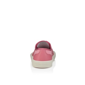Christian Louboutin sneaker in Bon Bon pink patent leather, rear view showing heel counter and cream rubber sole.