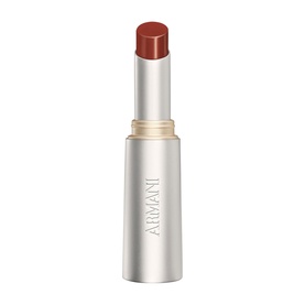 Armani Beauty Prisma Flash Lip Balm in a sleek silver bullet tube with a warm terracotta-red tinted balm visible at top