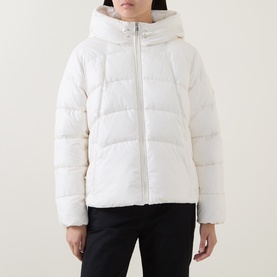 Model wearing Hugo Boss open white quilted hooded puffer jacket, styled with black trousers.