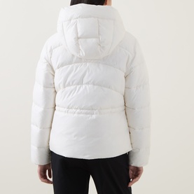 Model wearing Hugo Boss Open White quilted puffer coat with hood, rear view, styled with black trousers.