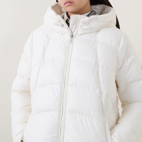 Model wearing Hugo Boss Open White quilted puffer coat with hood and zip fastening, styled with grey striped collar detail visible