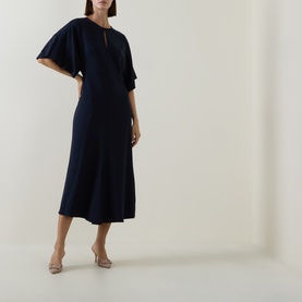 Model wearing Hugo Boss dark blue midi dress with flutter sleeves, keyhole neckline and flared skirt, styled with nude heeled mules