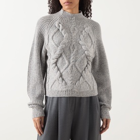 Model wearing Hugo Boss grey cable-knit wool-blend sweater with mock neck and textured diamond pattern, styled with dark wide-leg trousers.