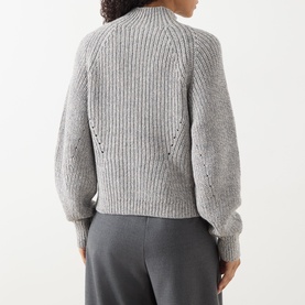 Model wearing Hugo Boss grey ribbed knit jumper, back view, with balloon sleeves and pointelle detail, styled with grey trousers