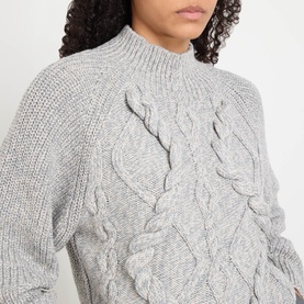 Model wearing Hugo Boss grey cable-knit wool-blend jumper with mock neck, featuring raised cable texture detail across the front.