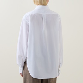 Model wearing Hugo Boss Saturday Patch Pocket Oversized Shirt in white, rear view showing curved hem, structured cuffs and centre back pleat.