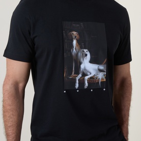 Model wearing Hugo black cotton T-shirt, back view, featuring large dog portrait graphic print.