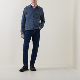Model wearing Paul Smith blue cotton casual jacket with chest pockets, styled with pink shirt and navy trousers