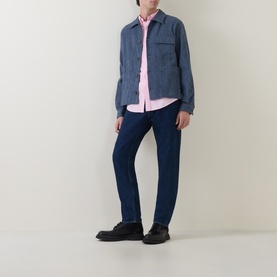 Model wearing Paul Smith blue cotton casual jacket, styled with pink shirt, dark indigo jeans and black leather shoes