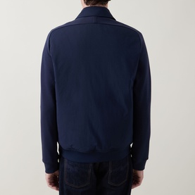 Model wearing Paul Smith Navy Casual Jacket, rear view, paired with dark denim jeans
