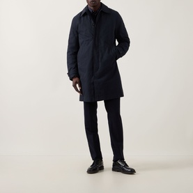 Model wearing Paul Smith Showerproof Car Coat in navy, styled with dark trousers and black leather shoes