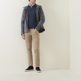 Model wearing Paul Smith grey casual jacket, styled with navy knitwear, beige trousers and navy suede shoes, carrying a dark crossbody bag
