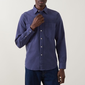 Model wearing Paul Smith navy casual shirt with chest pocket and button placket, styled with dark denim jeans