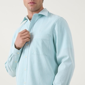Model wearing Paul Smith Textured Stripe Shirt in green, showing classic collar, chest pocket and long sleeves with button fastening.