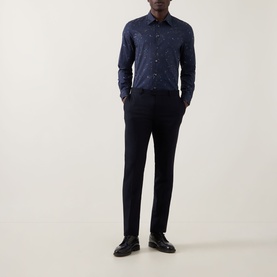 Model wearing Paul Smith Casual Abstract Print Shirt in navy with dark tailored trousers and black leather shoes.