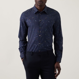Model wearing Paul Smith Casual Abstract Print Shirt in navy with abstract print, paired with navy trousers.