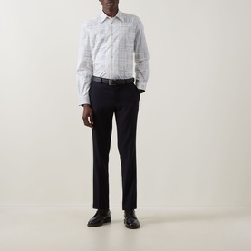 Model wearing Paul Smith white check casual shirt with dark tailored trousers and black leather shoes
