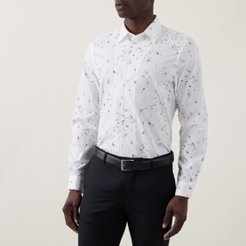 Model wearing Paul Smith Casual Abstract Print Shirt in white with navy trousers and black belt.