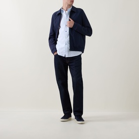 Model wearing Paul Smith Blue Casual Shirt in cotton, styled with navy harrington jacket and dark trousers, navy slip-on shoes.