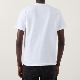 Model wearing Paul Smith Football Graphic Logo T-Shirt in white, rear view, short sleeves, straight hem, styled with dark jeans.