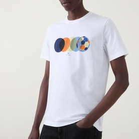 Model wearing Paul Smith Football Graphic Logo T-Shirt in white with multicoloured overlapping circle print on chest.
