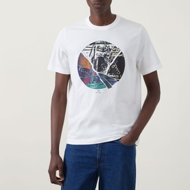 Model wearing Paul Smith Graphic Logo T-Shirt in white with circular graphic print, paired with blue jeans.