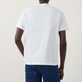 Model wearing Paul Smith Graphic Logo T-Shirt in white, back view, styled with dark blue jeans.
