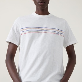 Model wearing Paul Smith Stripe Logo T-Shirt in white with multicolour stripe graphic print, round neck, and short sleeves.