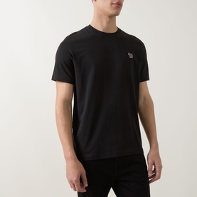 Model wearing Paul Smith black cotton crew neck T-shirt with small zebra logo patch on chest.