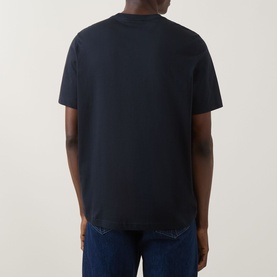 Model wearing Paul Smith Blue Crew Neck T-shirt, rear view, styled with blue denim jeans.
