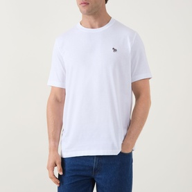 Model wearing Paul Smith white cotton crew neck T-shirt with small zebra logo embroidery, styled with blue jeans.