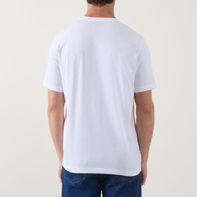 Model wearing Paul Smith white cotton crew neck T-shirt, back view, styled with blue jeans.