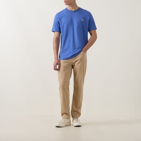 Model wearing Paul Smith Blue Zebra Badge T-Shirt with khaki trousers and white trainers.