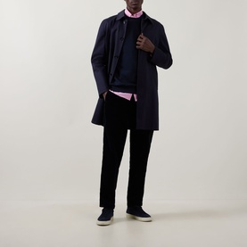 Model wearing Paul Smith Blue Crew Neck sweatshirt, styled with navy overcoat, pink shirt, black trousers and navy trainers.