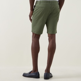 Model wearing Paul Smith Regular Fit Twill Chino Shorts in green, rear view, styled with navy loafers