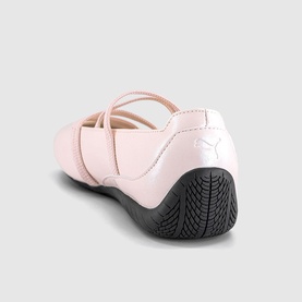 Puma women's flat shoe in Jasmine Flower pink, cross-strap upper, white logo, black rubber sole, rear view.