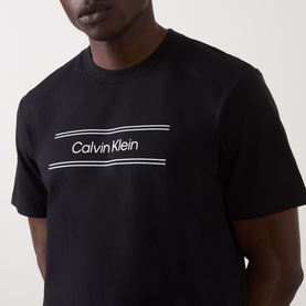 Model wearing Calvin Klein 20S SPW Graphic Logo T-Shirt in black with white contrast logo lettering across chest, crew neckline