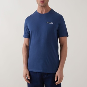 Model wearing Calvin Klein 30S Graphic Logo T-Shirt in Dark Denim, crew neck, short sleeves, small chest logo detail