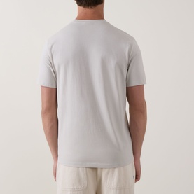 Model wearing Calvin Klein Micro Logo T-Shirt in Moonstruck, rear view showing crew neck, short sleeves and straight hem in smooth cotton finish.
