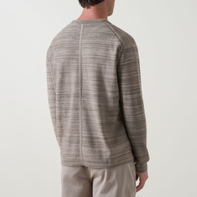 Model wearing Calvin Klein Tonal Slub Knitted Sweater in Roast Cashew, crew neck, dropped shoulders, long sleeves, ribbed trims, shown from rear
