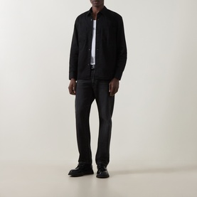 Model wearing black zip-through overshirt, styled with white T-shirt, dark grey jeans and black leather shoes
