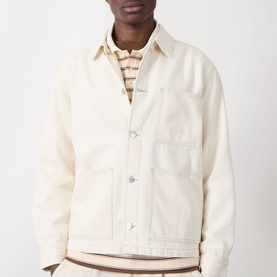 Model wearing Samsoe & Samsoe Chore Denim Jacket in Soft Natural, styled with a striped top, showing pointed collar and patch pockets