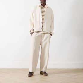 Model wearing Samsoe & Samsoe Soft Natural Chore Denim Jacket with matching trousers, striped tee, and brown shoes.
