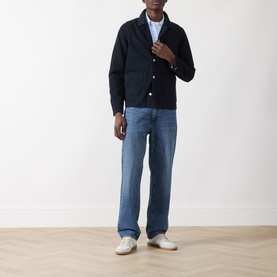 Model wearing Samsoe & Samsoe New Worker Denim Jacket in Salute, styled with blue jeans and white trainers