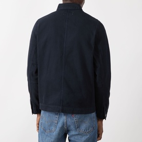 Model wearing Samsoe & Samsoe New Worker Denim Jacket in Salute, rear view, styled with light blue jeans