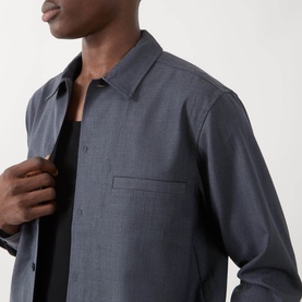 Model wearing Samsoe & Samsoe Casual Shirt in Salute Mel., showing chest pocket detail and open collar, styled over black top