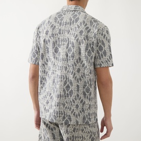 Model wearing Samsoe & Samsoe Salute Symmetry casual shirt, rear view, with matching shorts, short sleeves and geometric print